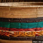 감비아 수공예품 및 기념품 - A detailed close-up of a traditional Gambian handcrafted basket made from natural sisal fibers, show...